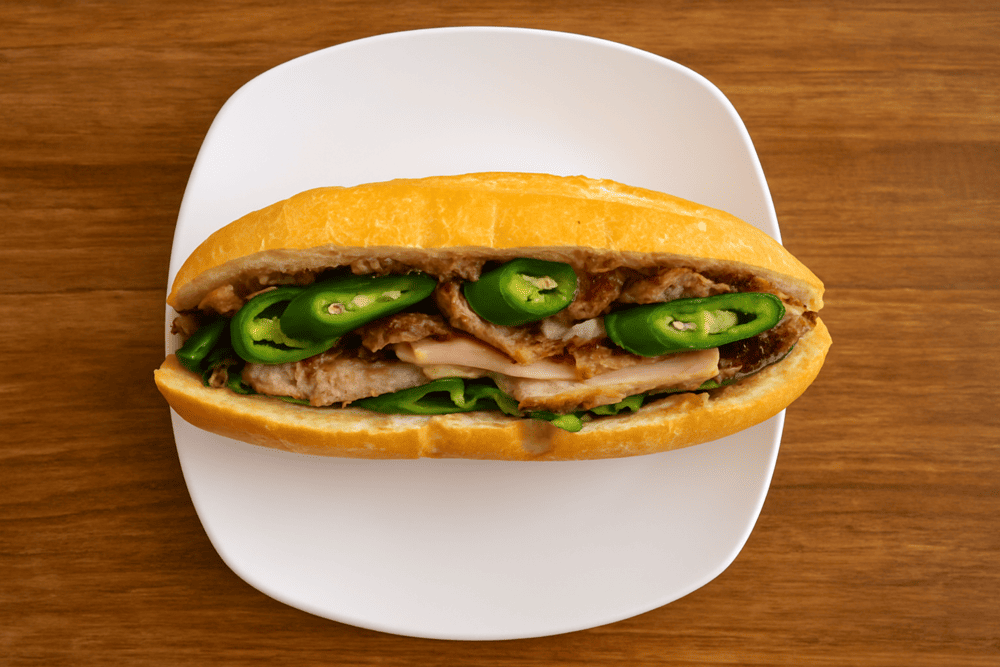 What sets the banh mi thap cam at Banh Mi Phuong apart is its signature homemade sauce